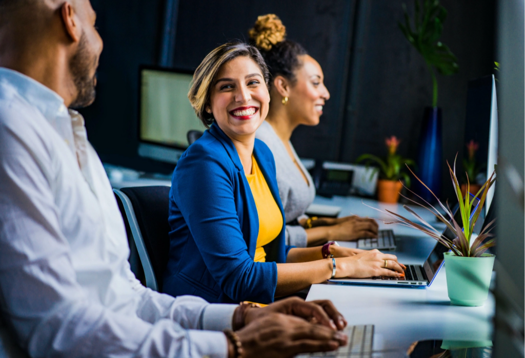 woman and man laughing at office