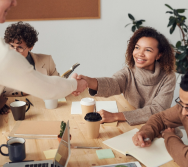 group of people around desk image
