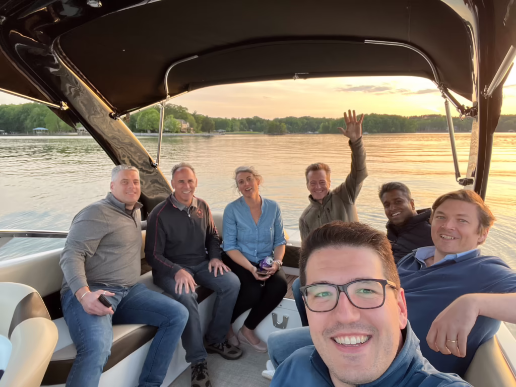 Selfie photo on boat of Taulia employees