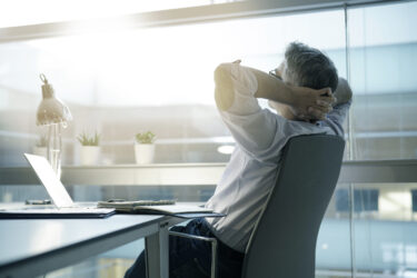 Businessman,In,Office,Relaxing,In,Chair