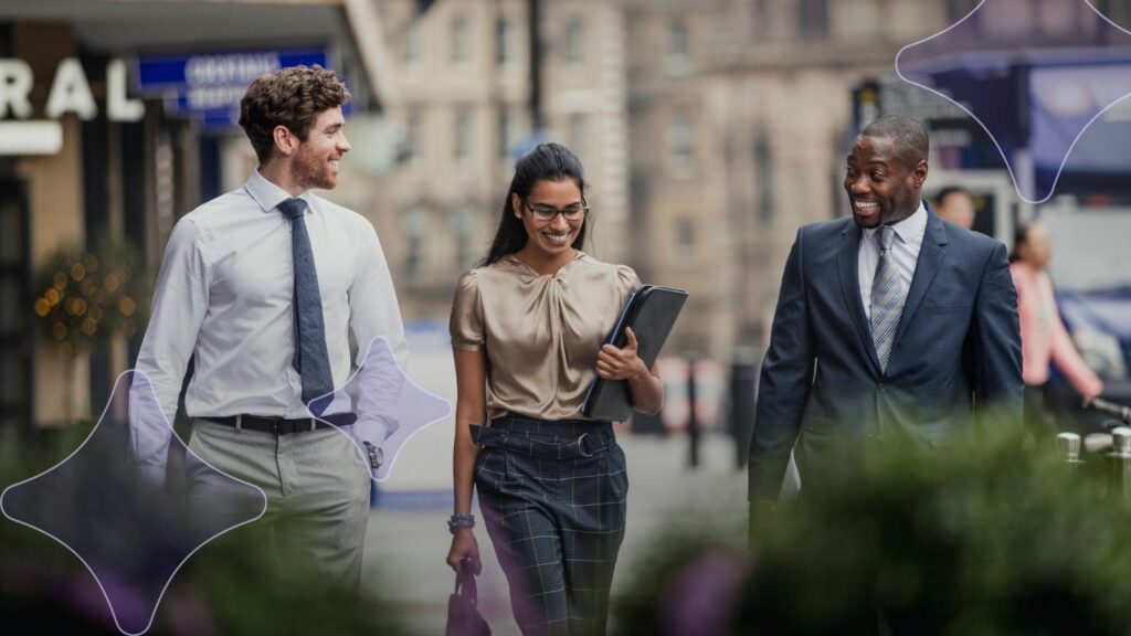 Smiling office workers walking on street