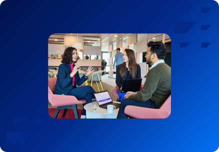 Woman speaking with two other people on chairs in office featured image